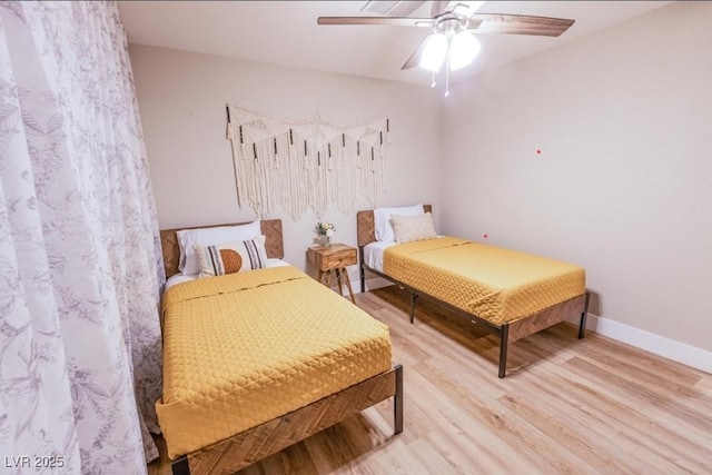 2043 Sombrero Dr, Las Vegas, NV 89169 - bedroom with light wood-style flooring, ceiling fan, and baseboards
