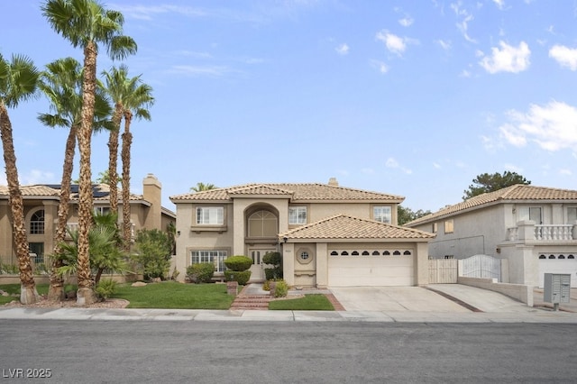 mediterranean / spanish house featuring a garage, driveway, stucco siding, a tile roof, and a chimney