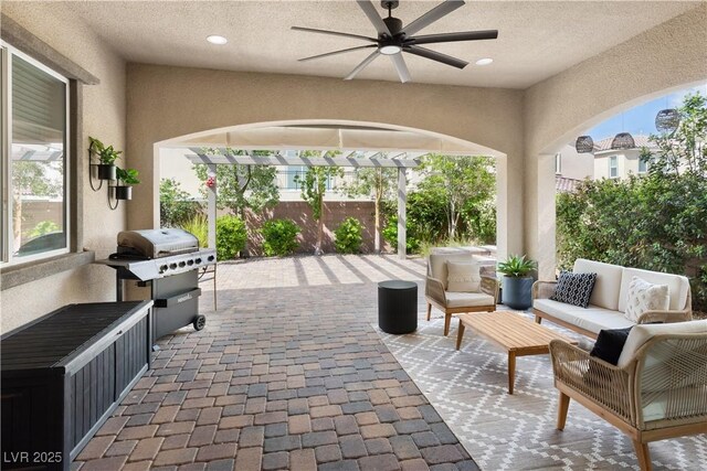 view of patio featuring outdoor lounge area, grilling area, and ceiling fan