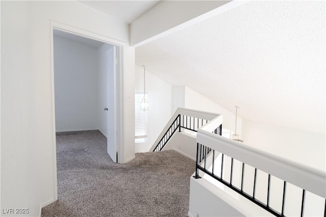 stairs with carpet and vaulted ceiling