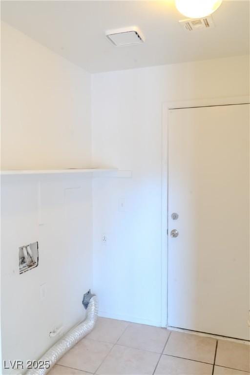 washroom featuring light tile patterned floors and washer hookup