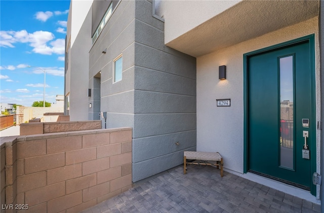 entrance to property featuring fence