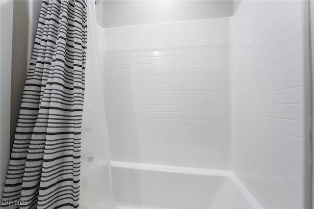 bathroom with shower / bathtub combination with curtain