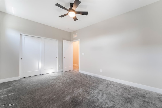 unfurnished bedroom featuring carpet flooring, baseboards, a closet, and ceiling fan