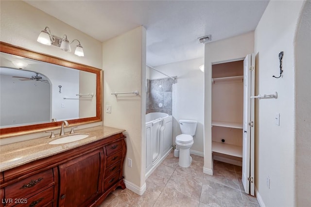 632 Arrayo Way, Boulder City, NV 89005 - full bathroom with ceiling fan, a shower, vanity, and toilet