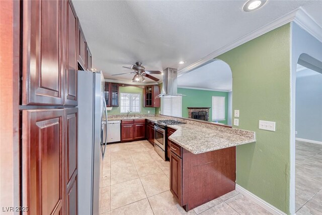632 Arrayo Way, Boulder City, NV 89005 - kitchen featuring stainless steel appliances, island exhaust hood, ornamental molding, arched walkways, and a sink