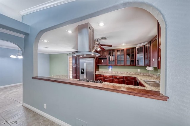 632 Arrayo Way, Boulder City, NV 89005 - kitchen with stainless steel appliances, island exhaust hood, crown molding, arched walkways, and a sink