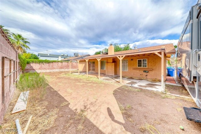 632 Arrayo Way, Boulder City, NV 89005 - back of house with a patio, a chimney, a fenced backyard, and stucco siding