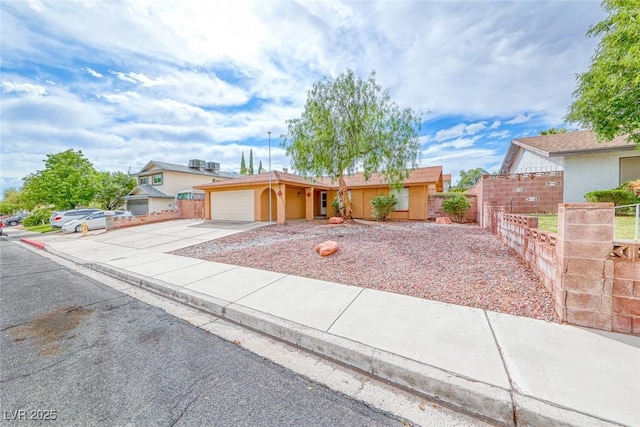 632 Arrayo Way, Boulder City, NV 89005 - ranch-style house featuring concrete driveway, an attached garage, fence, and stucco siding