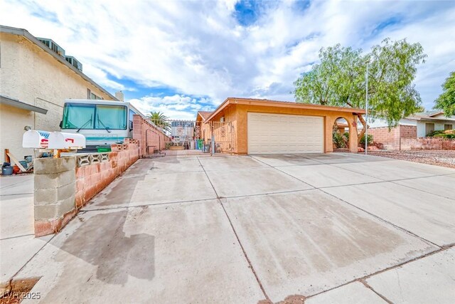 632 Arrayo Way, Boulder City, NV 89005 - view of front of house featuring concrete driveway, fence, an attached garage, and stucco siding