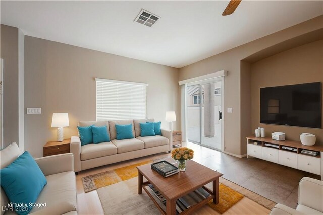 living room featuring a ceiling fan