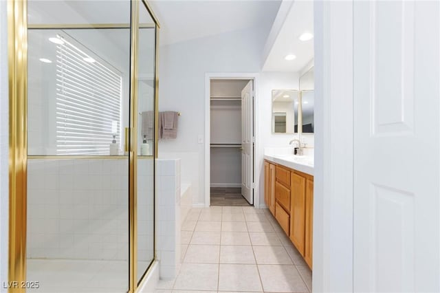 1246 E Gary Ave, Las Vegas, NV 89123 - bathroom featuring a shower stall, vanity, a garden tub, tile patterned floors, and lofted ceiling