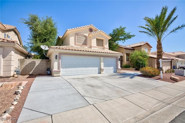 1246 E Gary Ave, Las Vegas, NV 89123 - mediterranean / spanish home with driveway, stucco siding, an attached garage, and a tiled roof