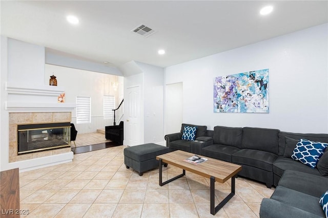 1246 E Gary Ave, Las Vegas, NV 89123 - living area featuring light tile patterned flooring, a fireplace, stairway, and recessed lighting