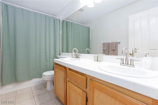 1246 E Gary Ave, Las Vegas, NV 89123 - bathroom with tile patterned floors, toilet, double vanity, and shower / bathtub combination with curtain