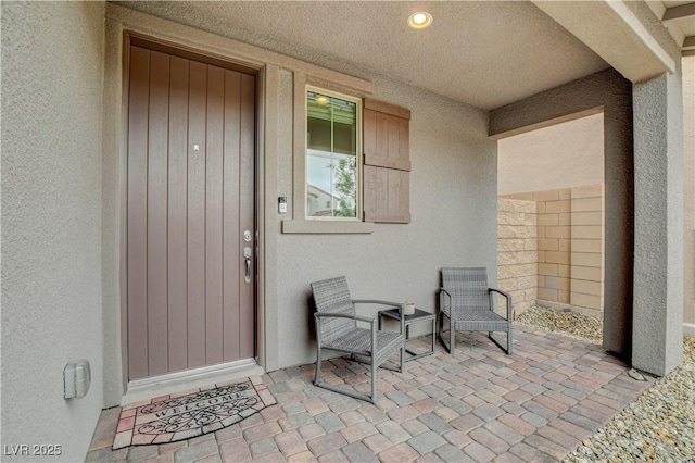 8801 Trotternish Ridge Dr, Las Vegas, NV 89166 - doorway to property featuring stucco siding