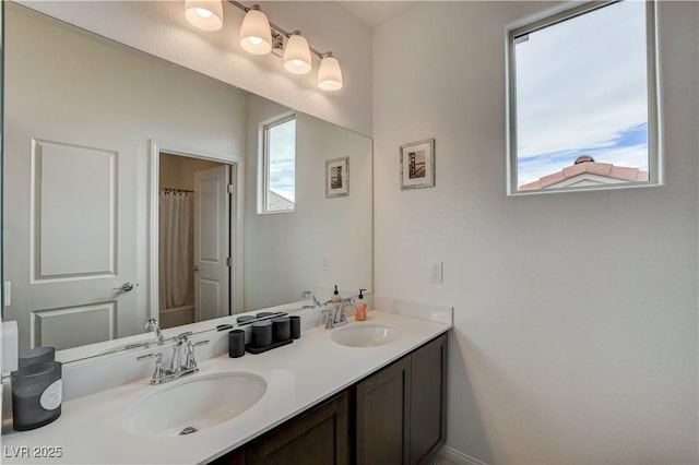 8801 Trotternish Ridge Dr, Las Vegas, NV 89166 - full bathroom with healthy amount of natural light, double vanity, and a shower with shower curtain