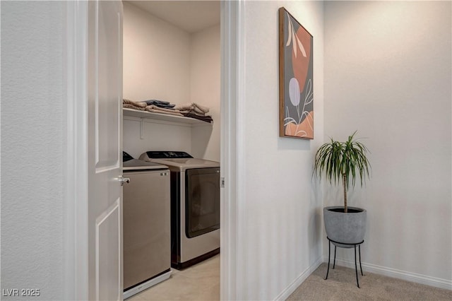 8801 Trotternish Ridge Dr, Las Vegas, NV 89166 - laundry area with washing machine and clothes dryer, baseboards, and light carpet