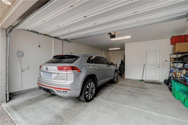 8801 Trotternish Ridge Dr, Las Vegas, NV 89166 - garage featuring a garage door opener