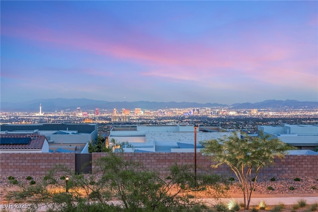 water view featuring a mountain backdrop and fence