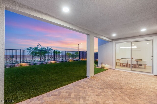 view of patio terrace at dusk