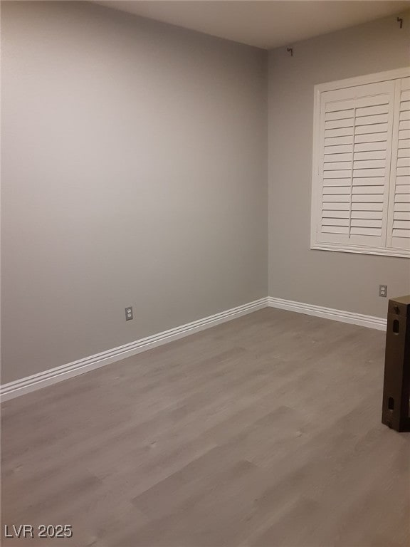 1006 Cove Palisades Dr, North Las Vegas, NV 89031 - empty room featuring baseboards and wood finished floors