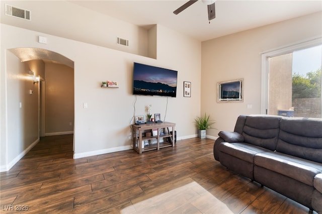 3839 Dusty Glen Ct, North Las Vegas, NV 89032 - living room featuring arched walkways, a ceiling fan, wood finished floors, and baseboards