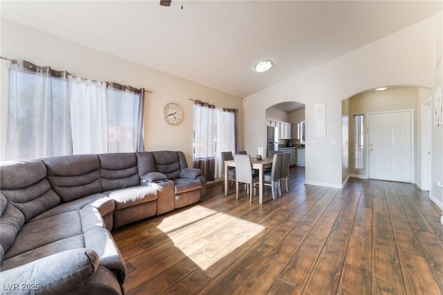 3839 Dusty Glen Ct, North Las Vegas, NV 89032 - living area with arched walkways, dark wood finished floors, and baseboards