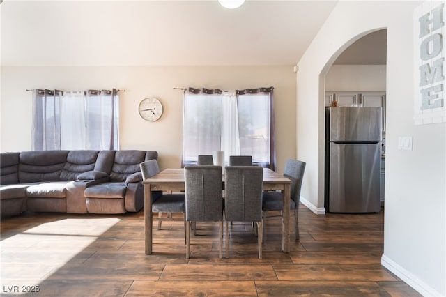 3839 Dusty Glen Ct, North Las Vegas, NV 89032 - dining area with arched walkways, dark wood-type flooring, and baseboards