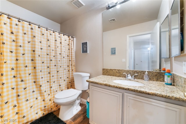 3839 Dusty Glen Ct, North Las Vegas, NV 89032 - bathroom featuring wood finished floors, toilet, vanity, and curtained shower