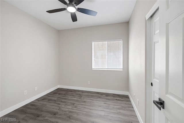 unfurnished room with a ceiling fan, dark wood finished floors, and baseboards