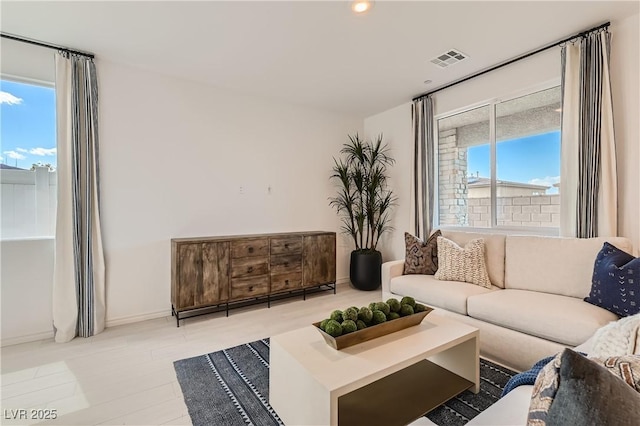 living area with recessed lighting and baseboards