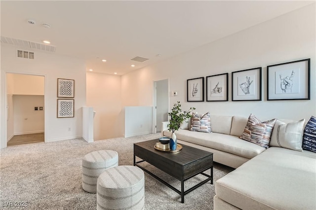 living room with carpet floors, recessed lighting, and baseboards