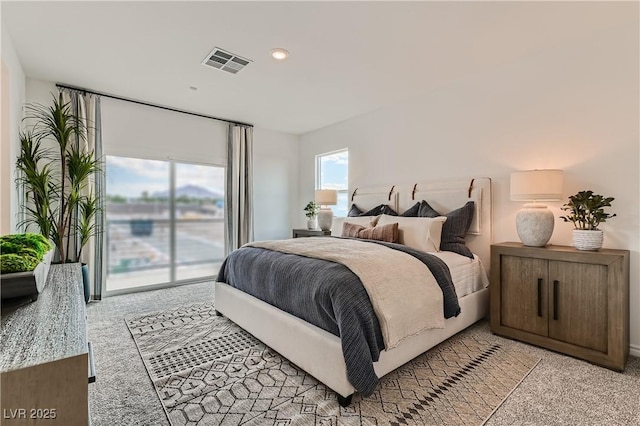 bedroom featuring light colored carpet, access to exterior, and recessed lighting