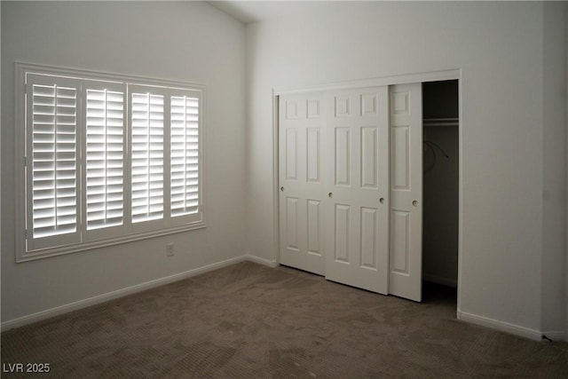 8355 Cabin Peak St, Las Vegas, NV 89123 - unfurnished bedroom with carpet flooring, a closet, baseboards, and multiple windows
