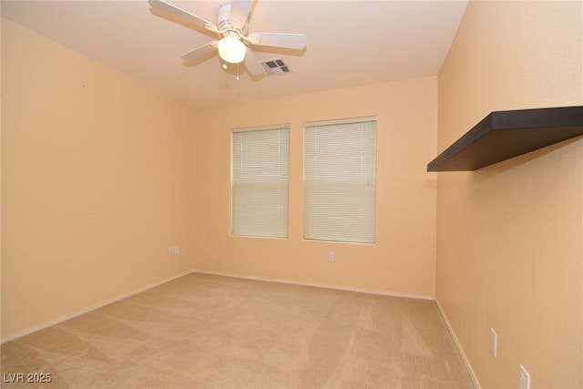 8842 Duncan Barrel Ave Unit 101, Las Vegas, NV 89178 - unfurnished room with light carpet, a ceiling fan, and baseboards