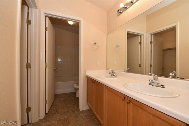 8842 Duncan Barrel Ave Unit 101, Las Vegas, NV 89178 - bathroom with toilet, double vanity, tile patterned flooring, baseboards, and  shower combination