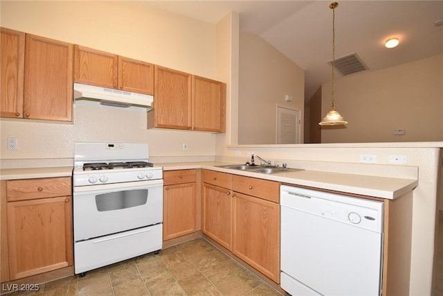 8842 Duncan Barrel Ave Unit 101, Las Vegas, NV 89178 - kitchen with white appliances, under cabinet range hood, a peninsula, a sink, and vaulted ceiling