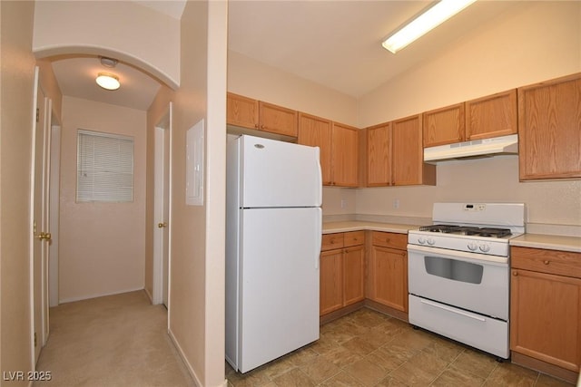 8842 Duncan Barrel Ave Unit 101, Las Vegas, NV 89178 - kitchen featuring white appliances, under cabinet range hood, light countertops, and arched walkways