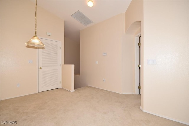 8842 Duncan Barrel Ave Unit 101, Las Vegas, NV 89178 - unfurnished room featuring arched walkways, light colored carpet, and baseboards
