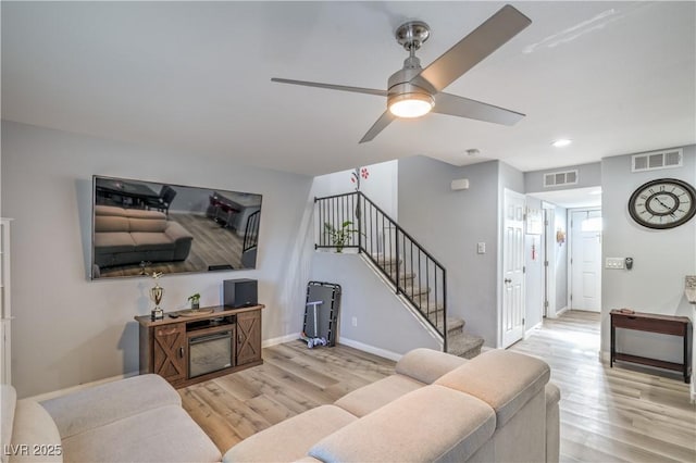 4078 Gold Coast Dr, Las Vegas, NV 89121 - living area featuring wood finished floors, stairs, a ceiling fan, baseboards, and recessed lighting