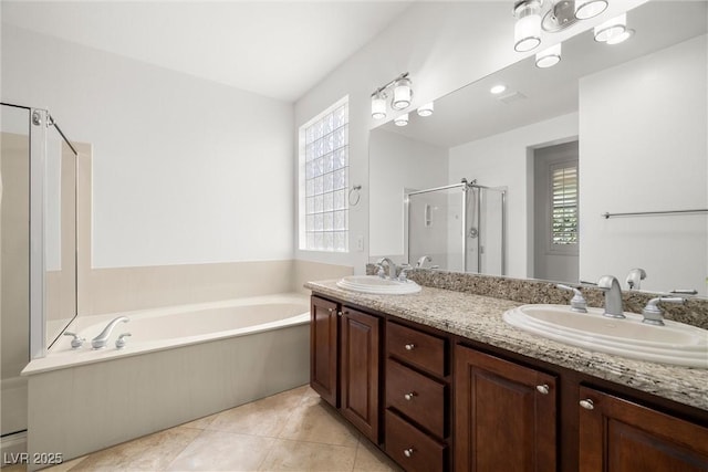 5067 Pensier St, Las Vegas, NV 89135 - full bath featuring a stall shower, a bath, double vanity, and tile patterned flooring