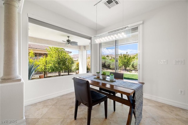 5067 Pensier St, Las Vegas, NV 89135 - dining space with decorative columns, plenty of natural light, light tile patterned floors, and ceiling fan