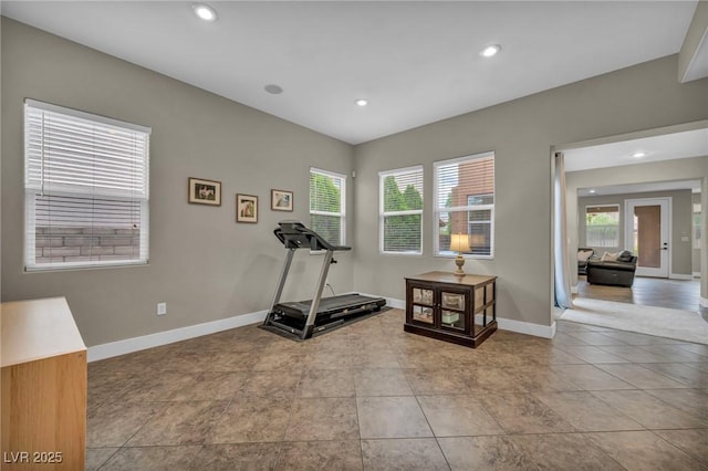 workout room with plenty of natural light, baseboards, recessed lighting, and tile patterned floors