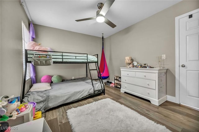 bedroom with wood finished floors and ceiling fan
