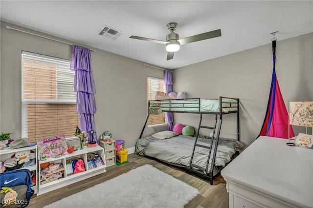 bedroom with wood finished floors and ceiling fan
