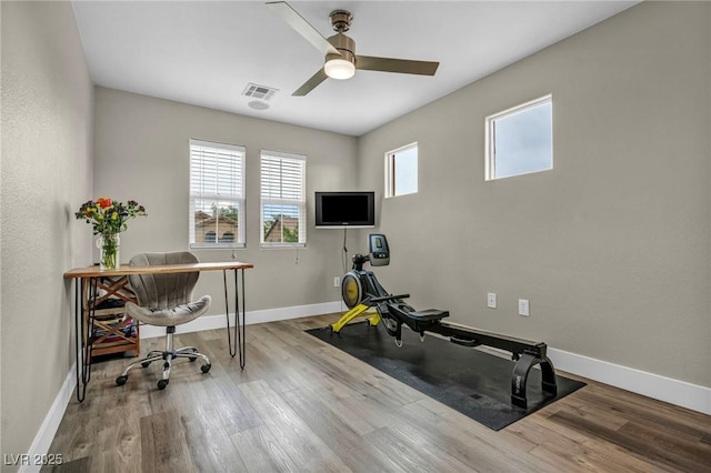 office area featuring ceiling fan, wood finished floors, and baseboards