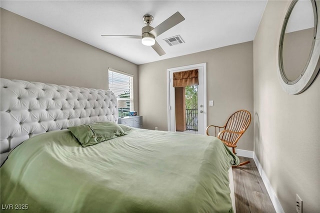 bedroom with baseboards, wood finished floors, access to exterior, and ceiling fan