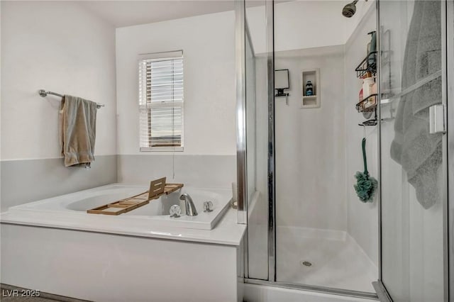 full bath featuring a shower stall and a bath