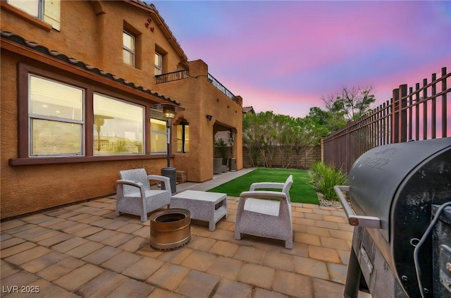 view of patio / terrace with area for grilling and a fenced backyard